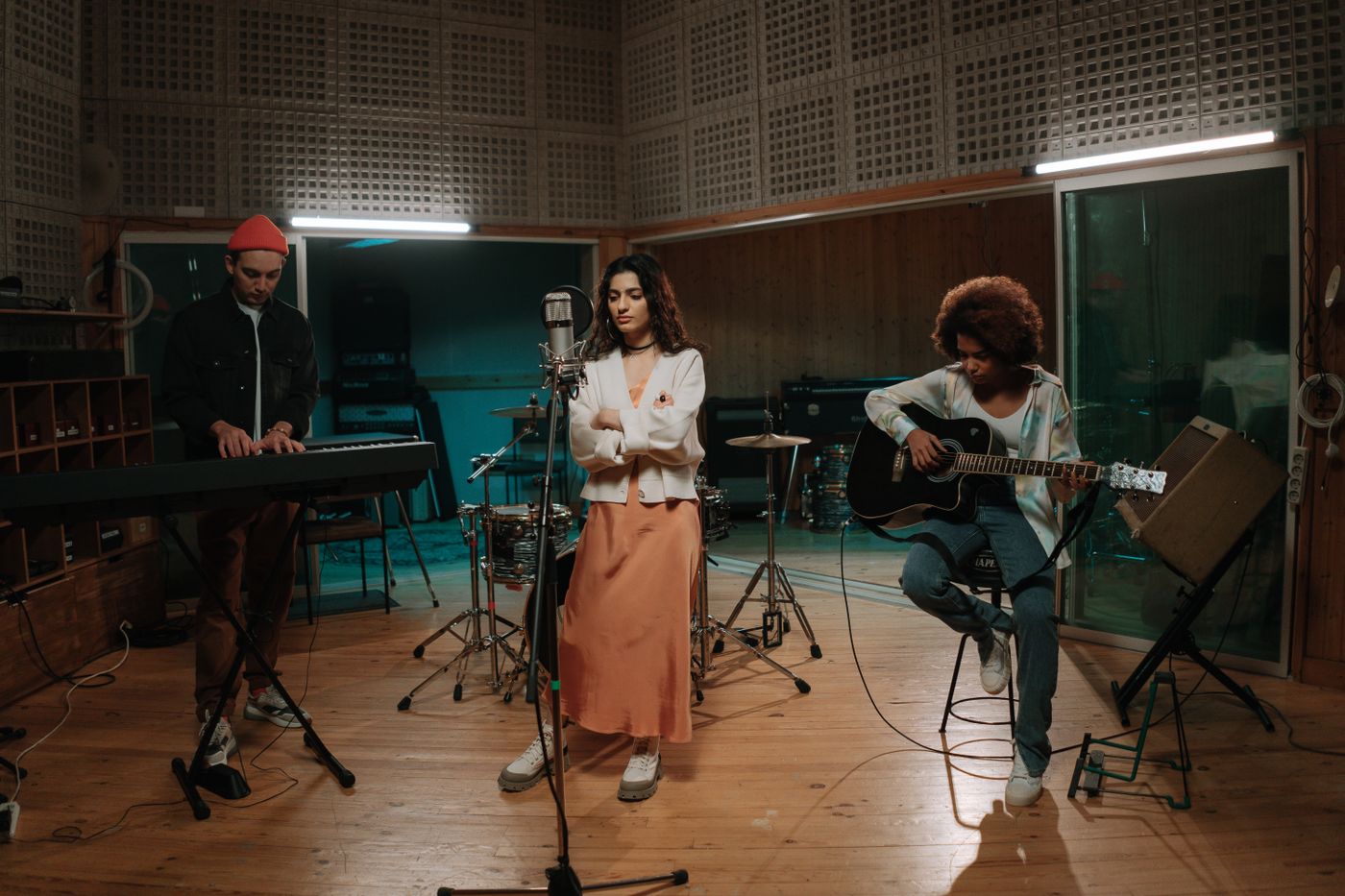 Musicians rehearsing together in a studio