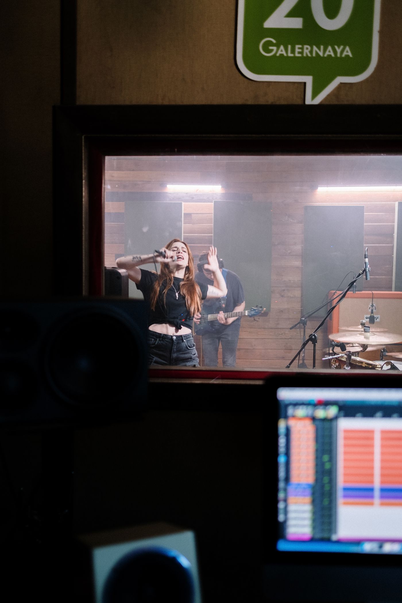 Musicians performing together in a recording studio