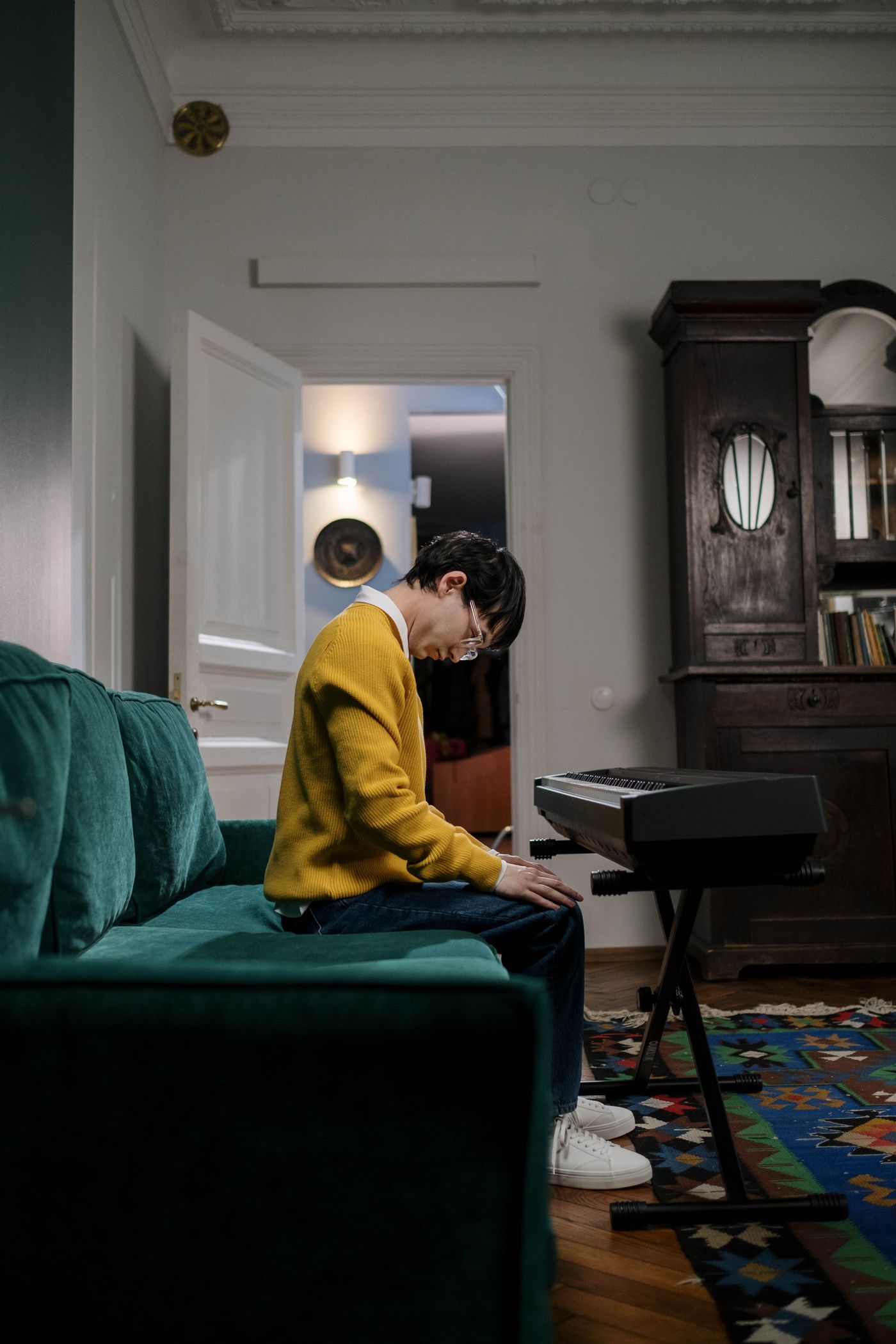 A musician practicing piano at home