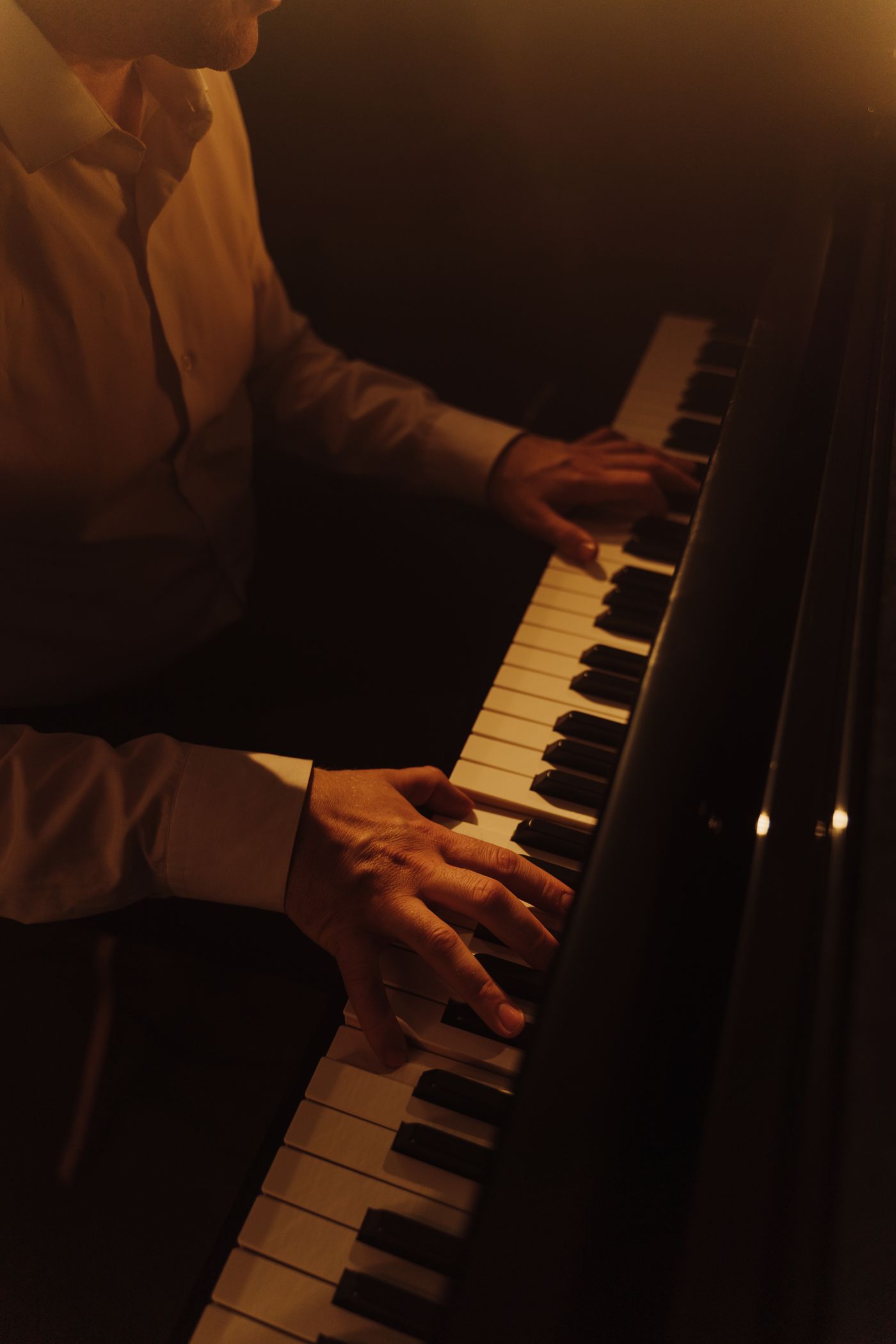 Hands performing a phrase on piano keys
